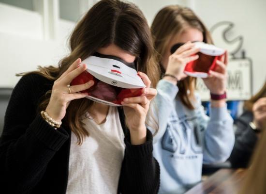 female students experimenting with virtual reality headsets